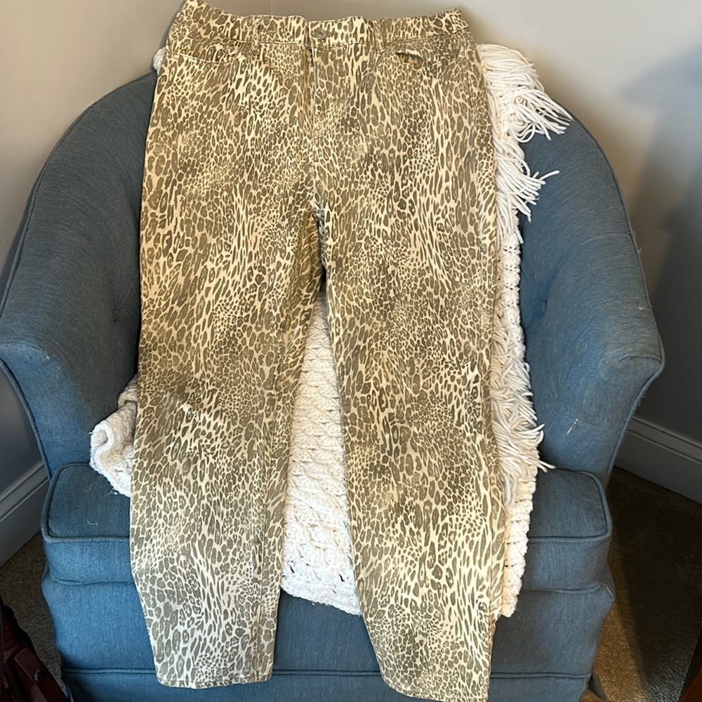 The platinum jeggings by Chicos size 1.5 or 10. Gold animal print with sparkles.